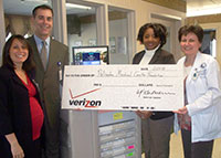 Verizon Presents PMC with $10,000 Check